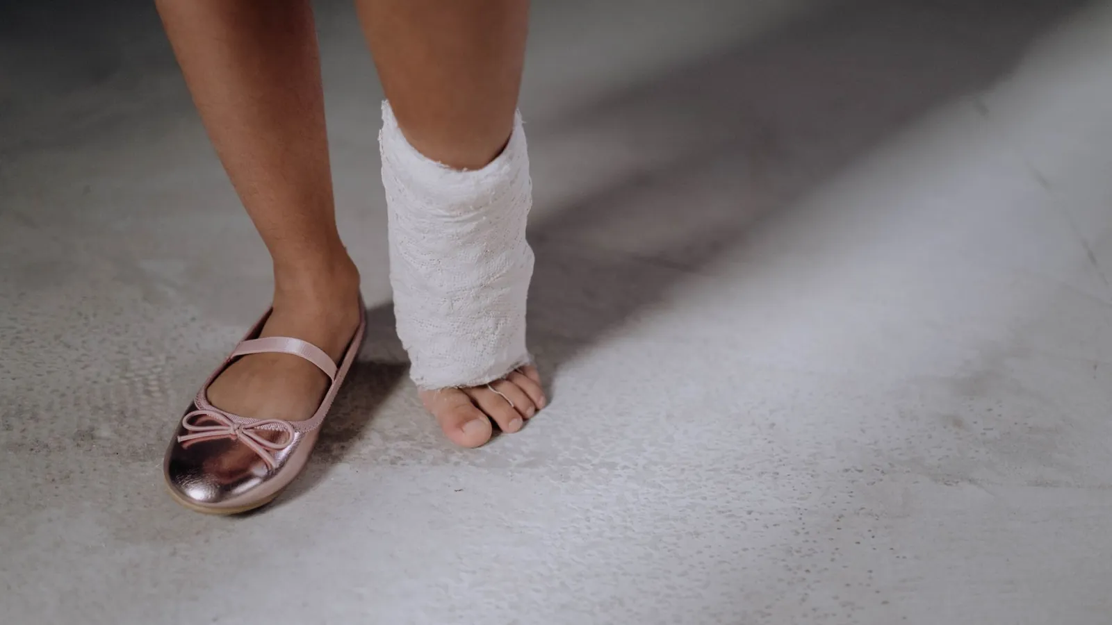 A foot and ankle wrapped in a compression bandage