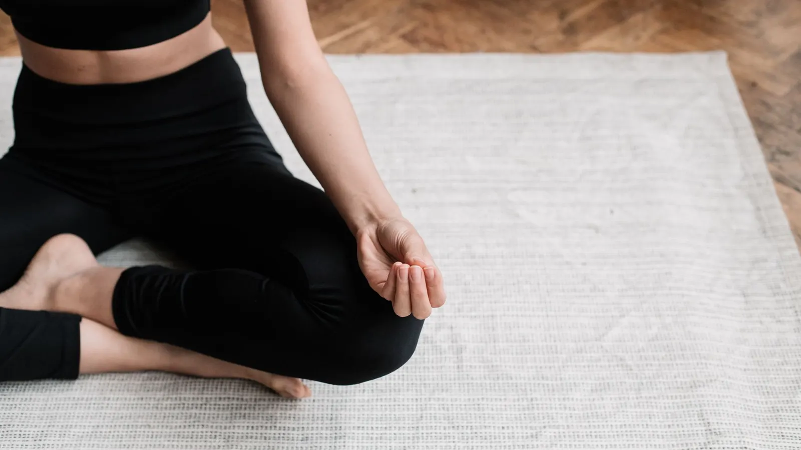 Close up of crossed legs while sitting on the floor
